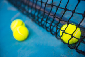 tennis ball on a tennis court with net, sport